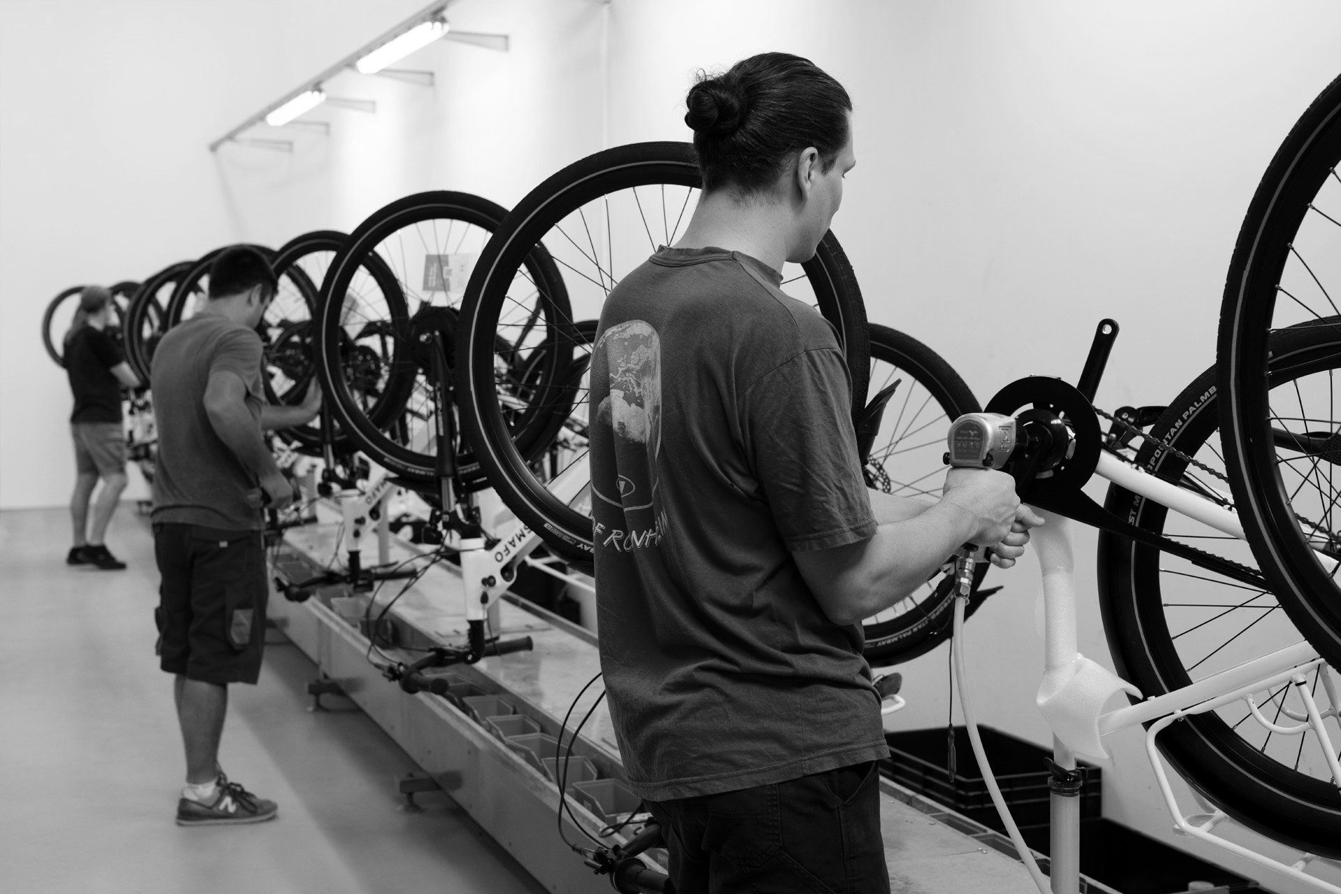 Technicians assembling e-bikes in Hungary
